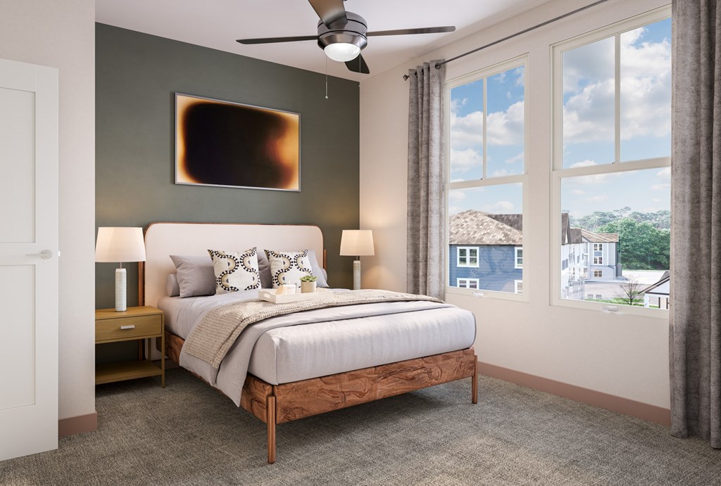 A bedroom with a large bed with large window at Easton at Mountain Island new apartments in Charlotte, NC.