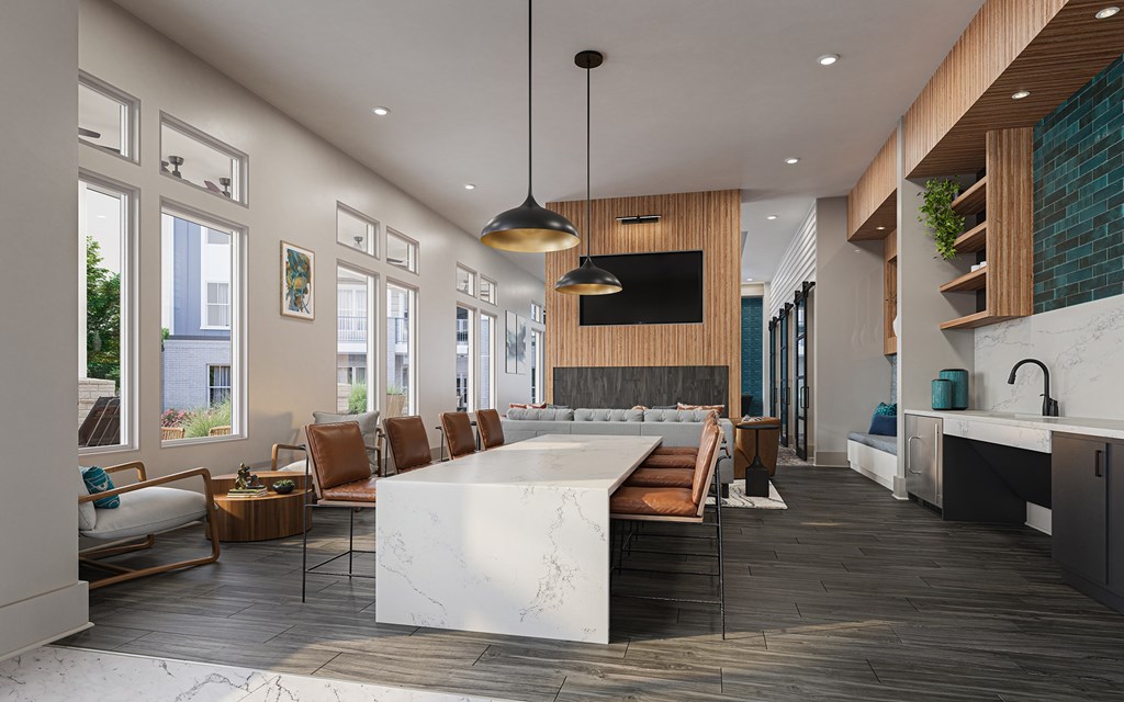 A modern kitchen with a large island and a living area with a couch and chairs at Easton at Mountain Island apartments in Charlotte, NC.