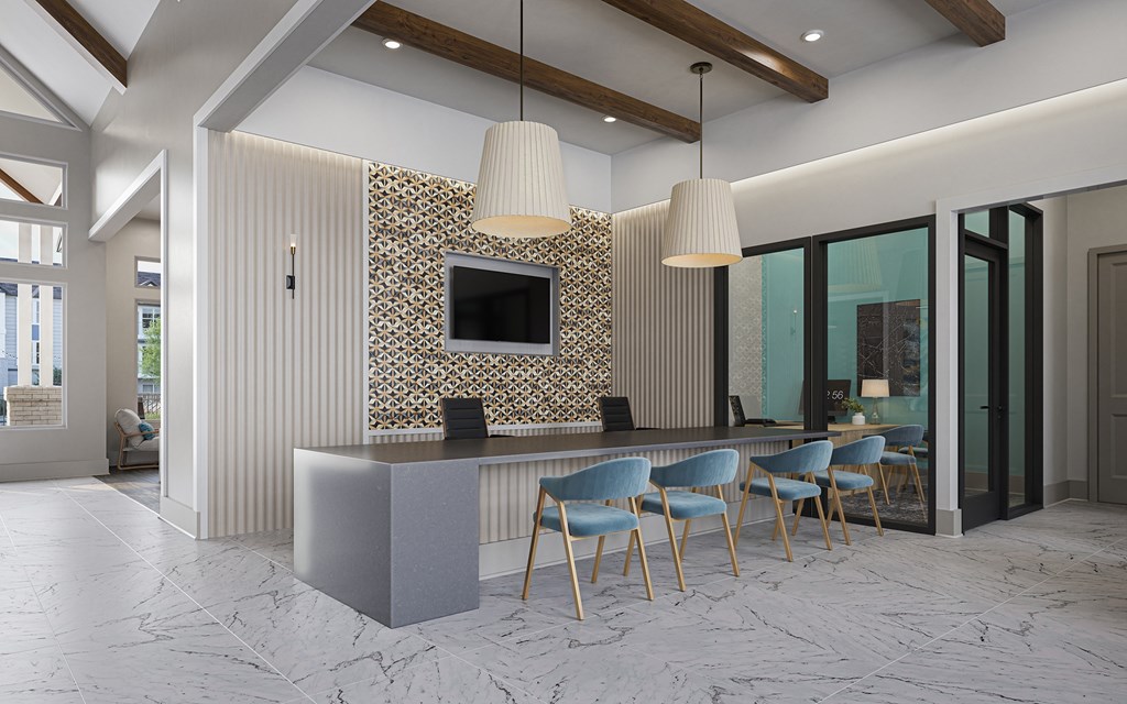 A modern living room with a television, chairs, and a patterned wallpaper at Easton at Mountain Island new apartments in Charlotte, NC.