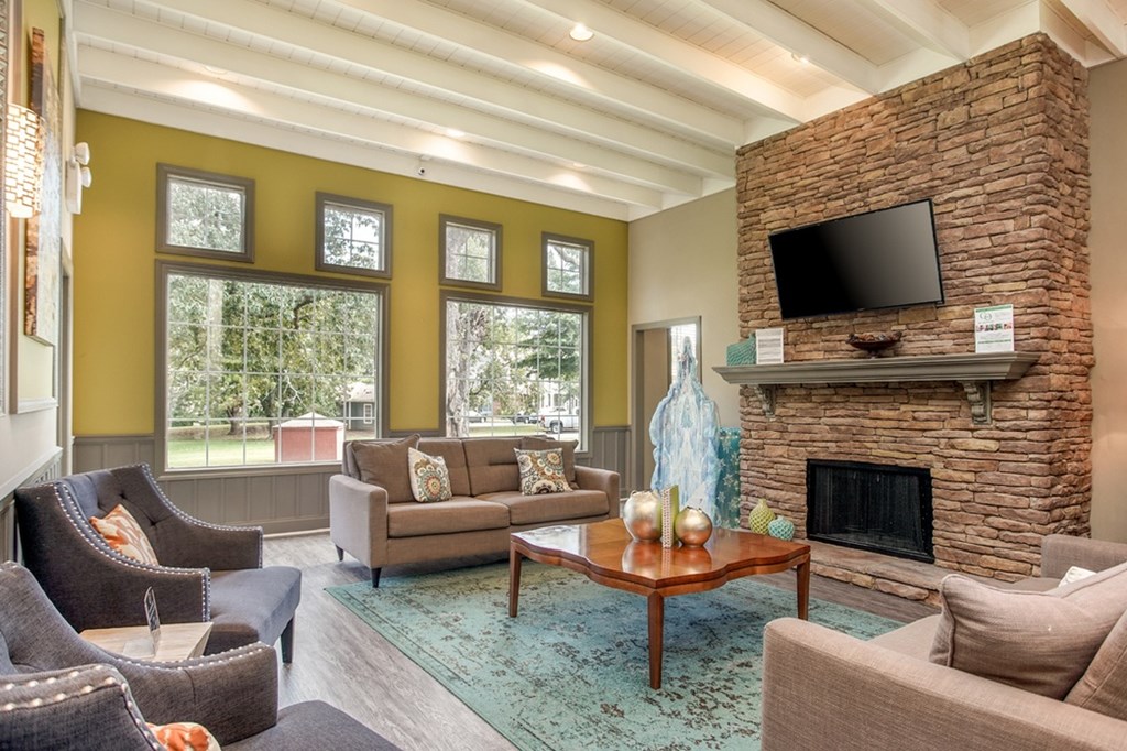 Clubhouse lounge with fireplace at Eastwood Village apartments in Stockbridge, GA.