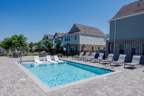 our apartments have a swimming pool with lounge chairs