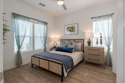 a bedroom with a bed and a dresser