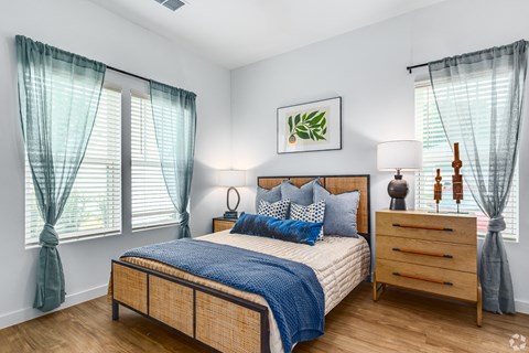 a bedroom with a bed and a dresser