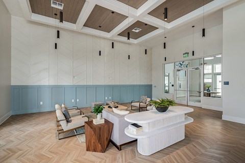 a large living room with a white couch and a table
