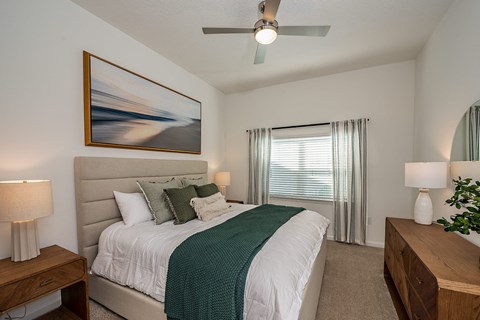 our bedrooms are spacious with a king size bed and a ceiling fan