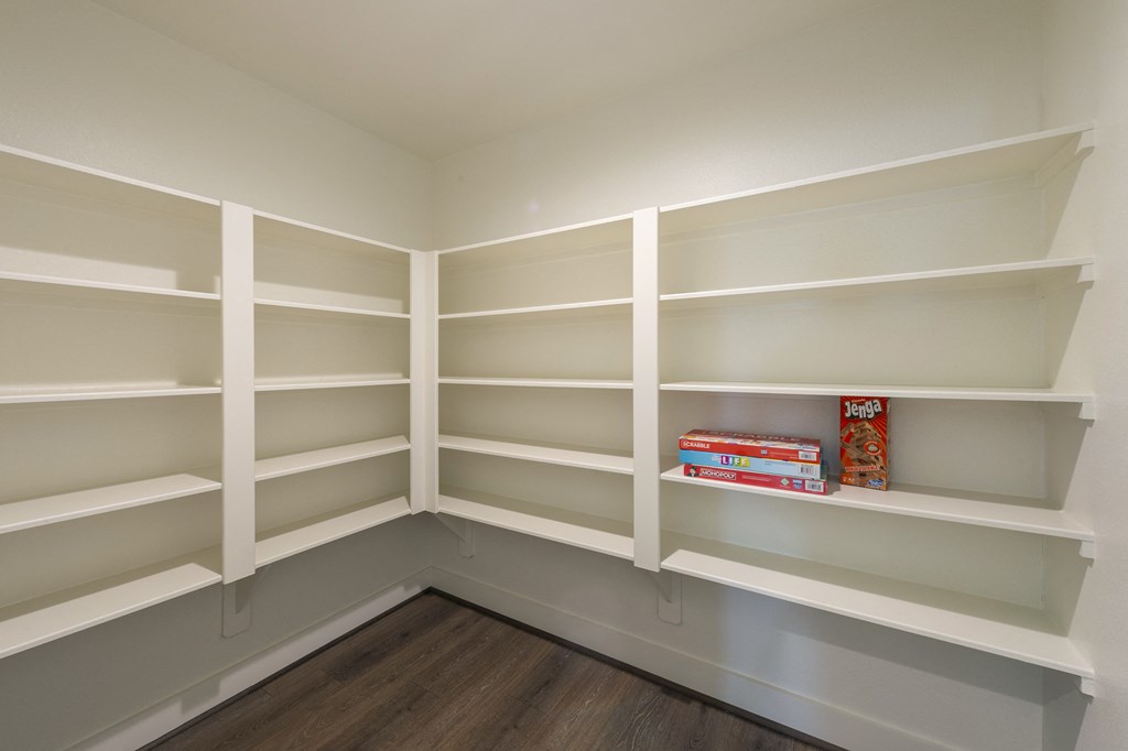 a book shelf in a room with empty shelves