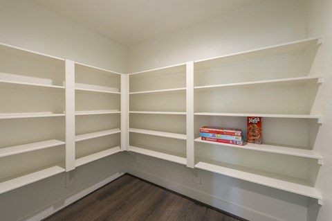 a book shelf in a room with empty shelves