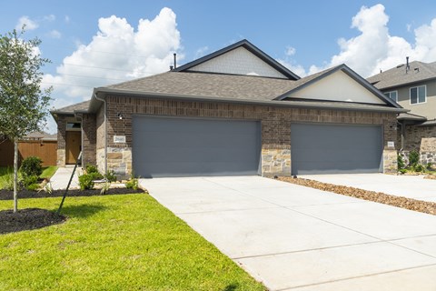 a garage door in front of a house