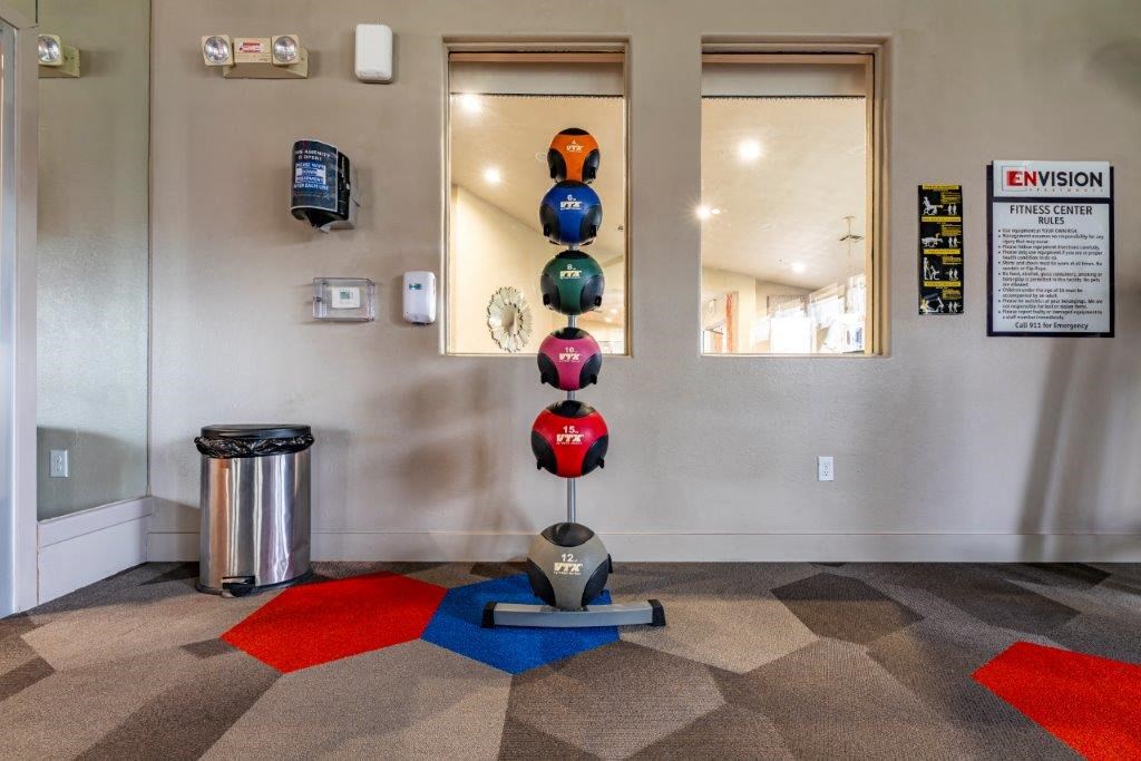 the lobby of a building with a colorful ball sculpture in the center