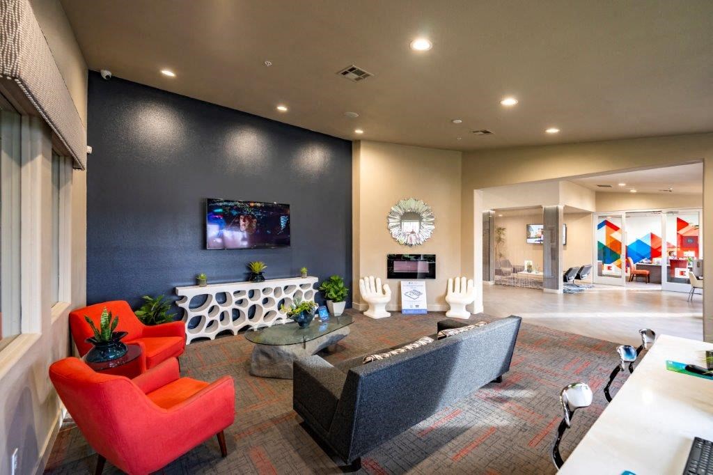 a large living room with furniture and a television