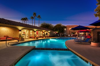 Mesa Luxury Apartments - Envision Apartments Swimming Pool and Spa at Dusk with Lounge Chairs - Photo Gallery 6