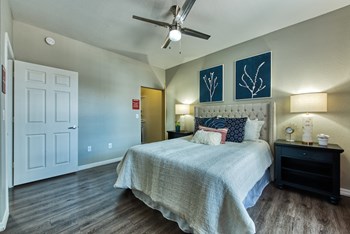 Two Bedroom Apartments in Mesa, AZ - Envision Apartments Spacious Bedroom with Wood-Style Flooring and Large, Attached Closet - Photo Gallery 5