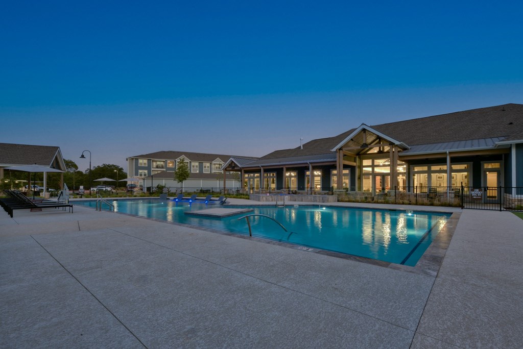 a swimming pool with a building in the background