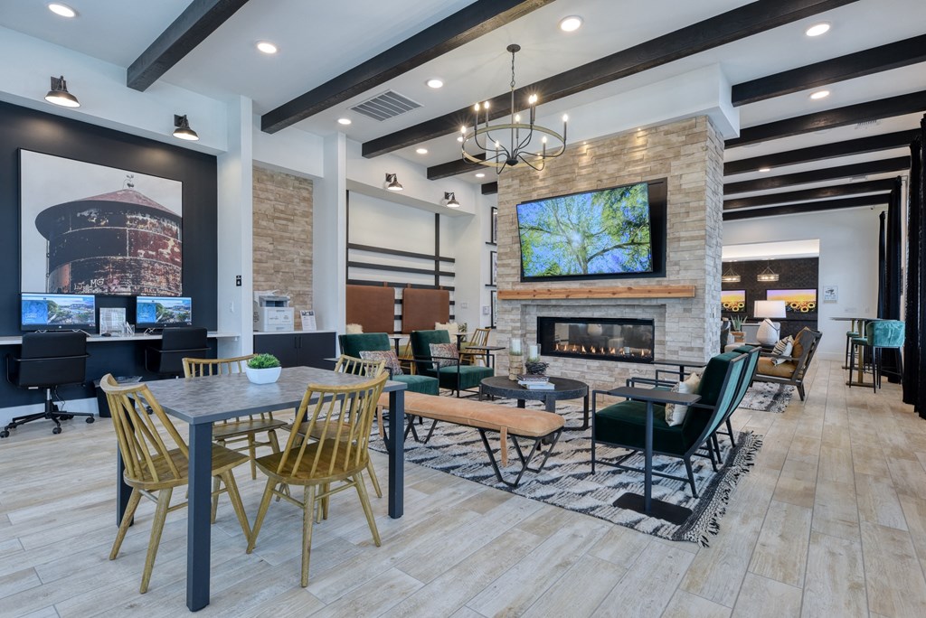 the reserve at bucklin hill clubhouse with fireplace and tables and chairs