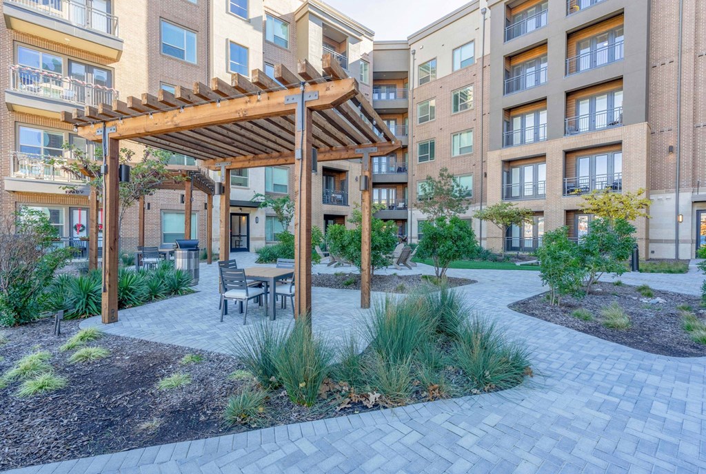 exterior courtyard with sitting area and pergola