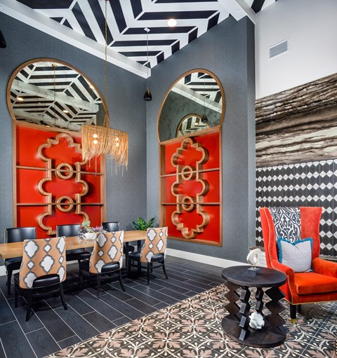 A dining room with a table set for six.