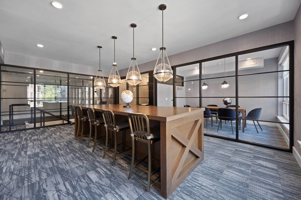 a dining room with a wooden table and chairs