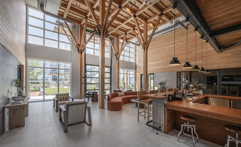 A modern interior with wooden beams and furniture.