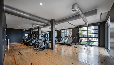 A gym with treadmills and exercise bikes.