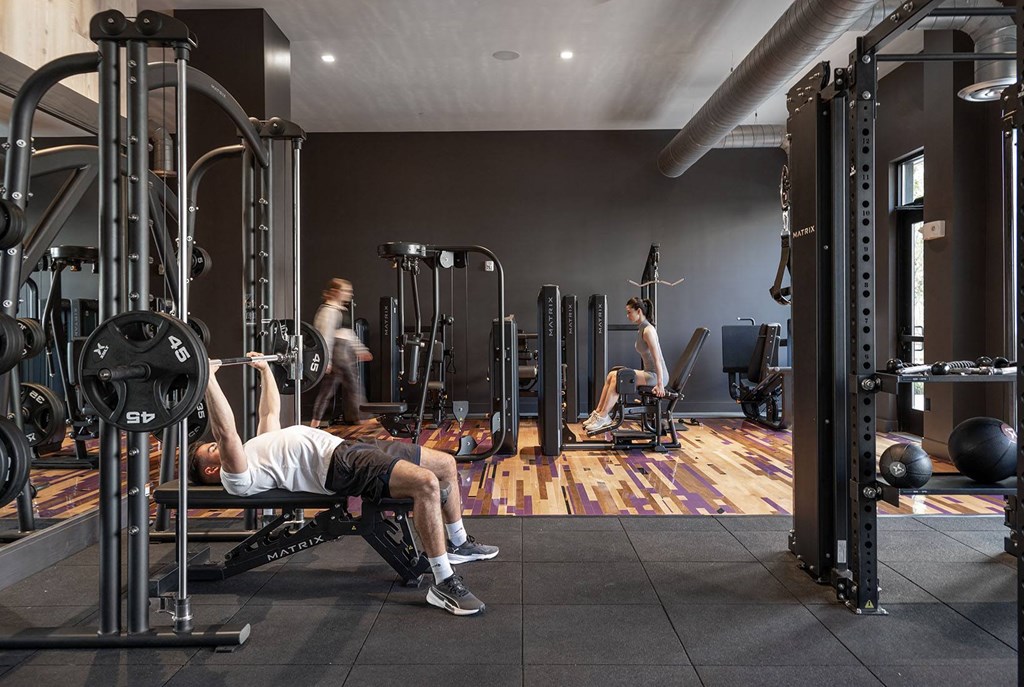 a group of men working out in a gym