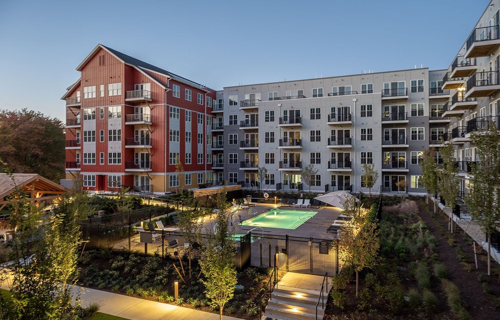 an aerial view of an apartment complex with a basketball court