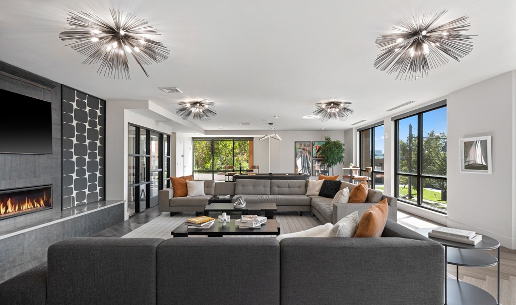 resident lounge living room with couches and a table and a fireplace