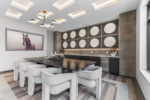 A modern dining room with a large painting of a horse on the wall.