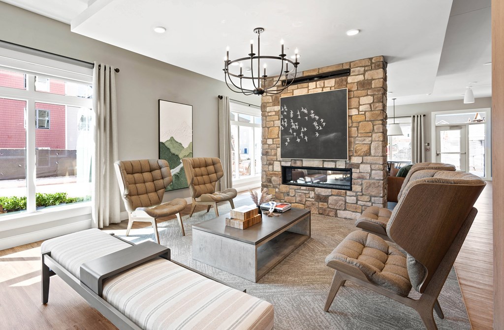 a living room with a stone fireplace and a couch