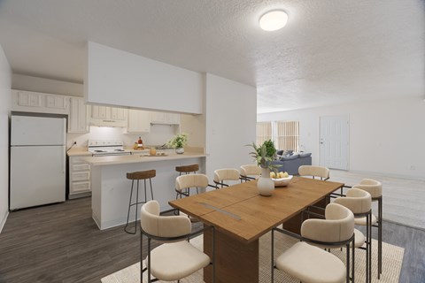 A modern kitchen with a dining table and chairs.