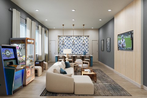 A modern living room with a large couch and a TV on the wall.