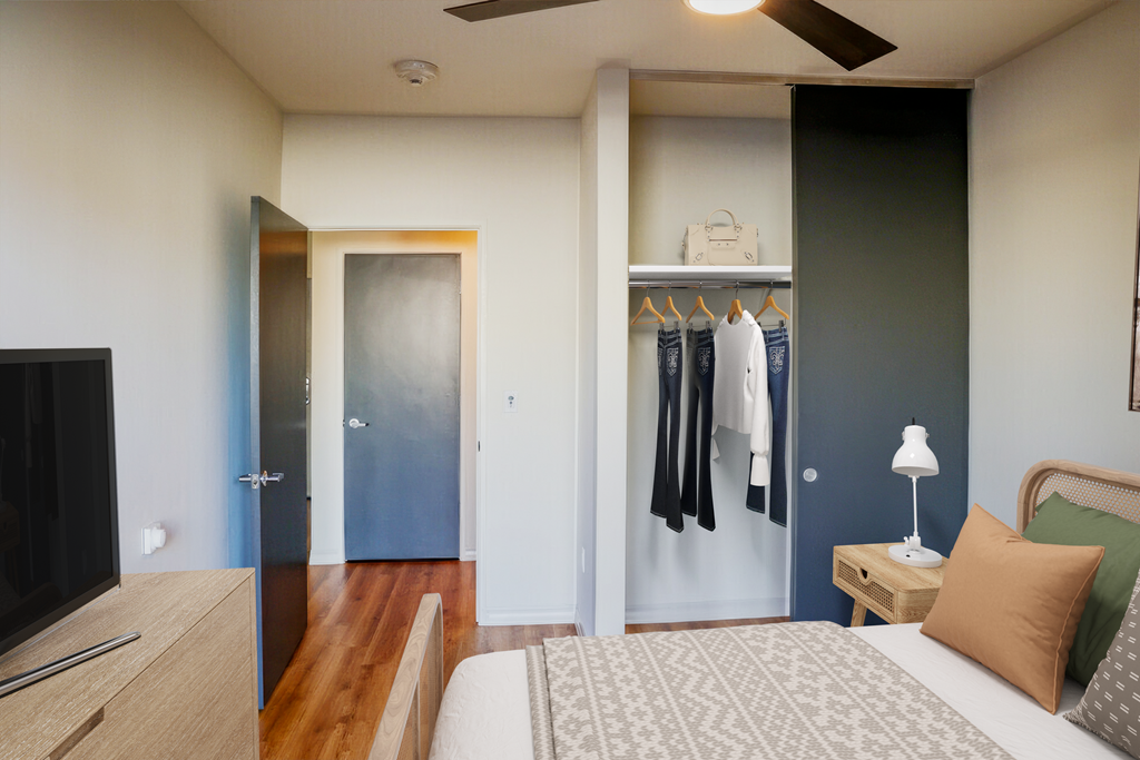 a bedroom with a bed and a closet with closet doors