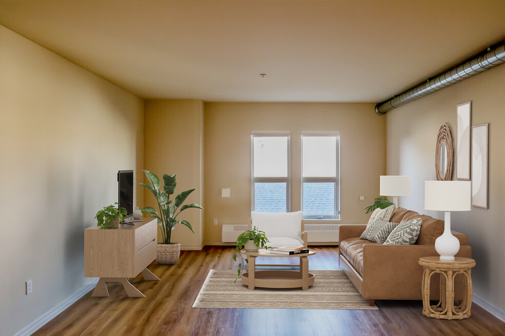 an empty living room with a couch and a tv