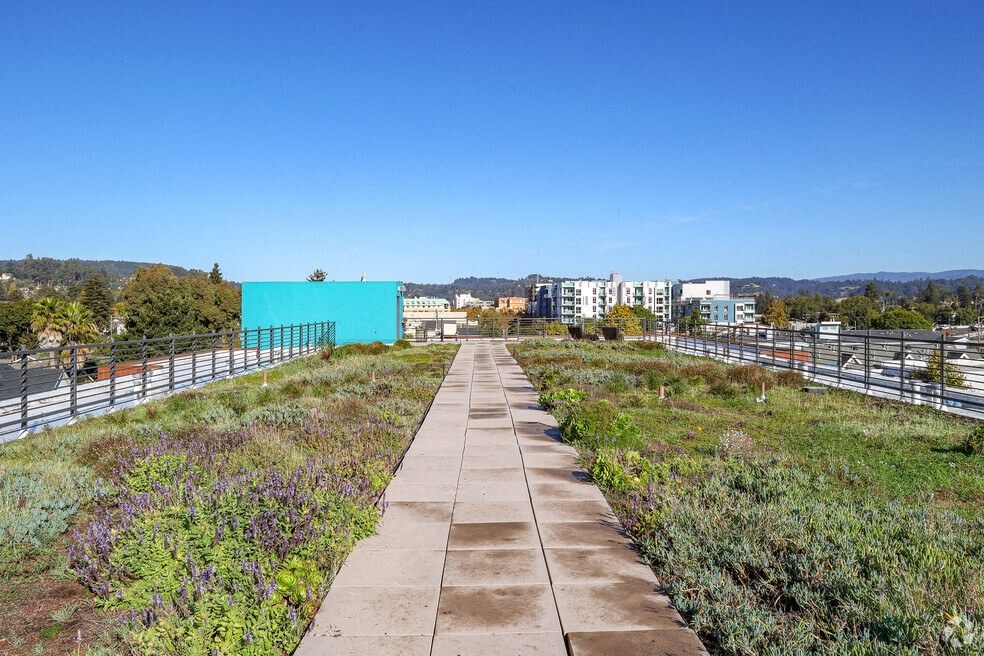 a view of a city from a walkway