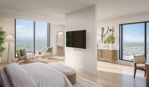 A modern bedroom with a large bed and a flat screen TV mounted on the wall.