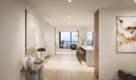 A modern living room with a view of the ocean.