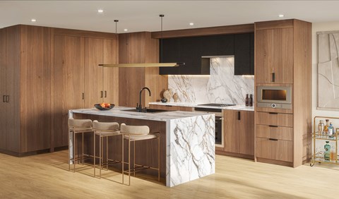 A modern kitchen with a marble island and wooden cabinets.