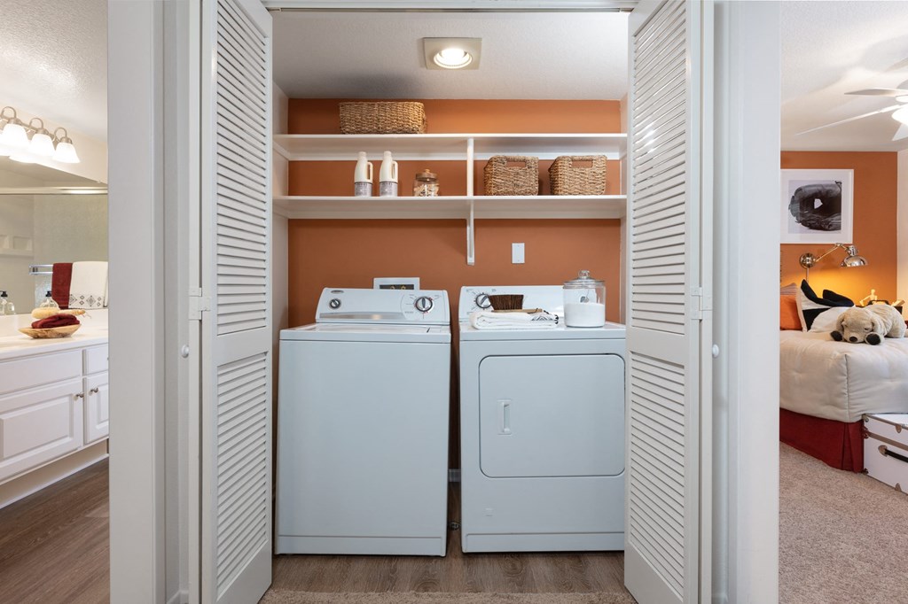 a laundry room with a washer and dryer