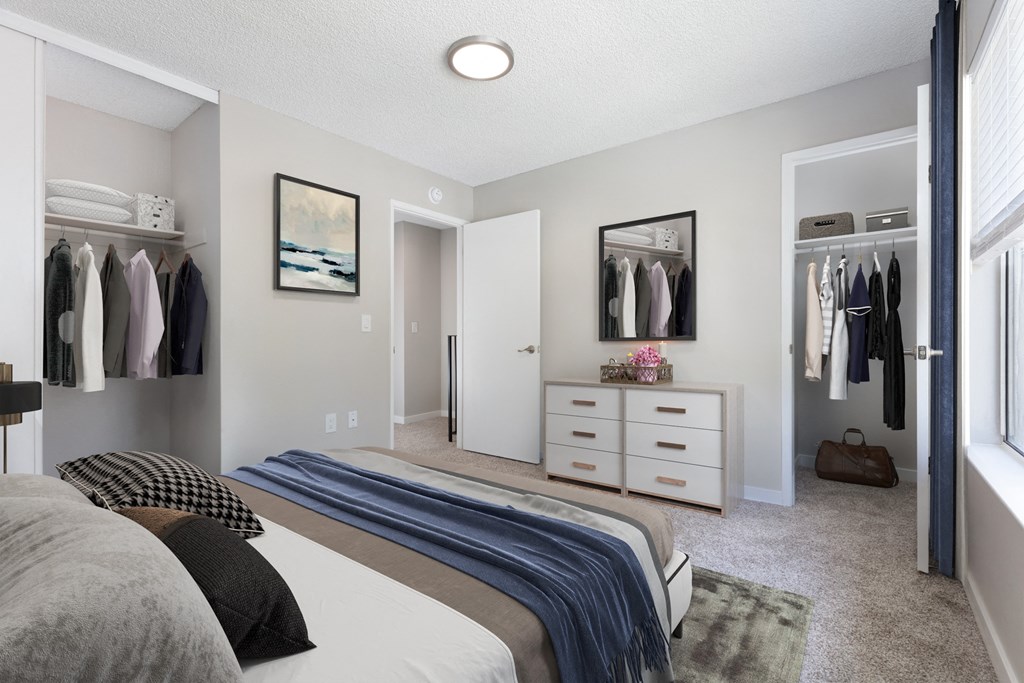 a bedroom with a bed and a dresser