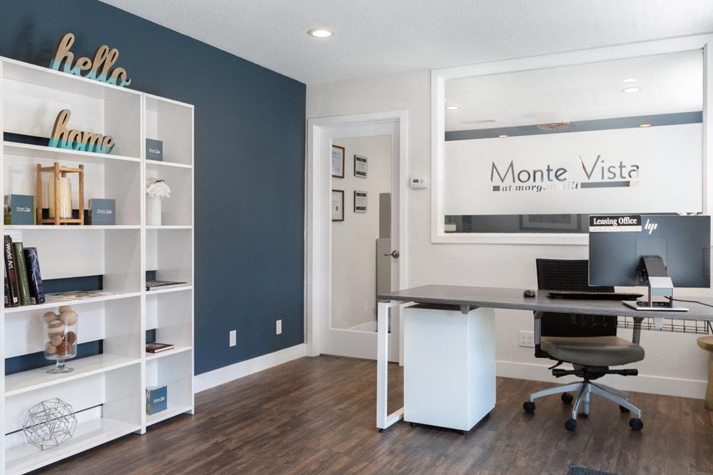 a home office with a desk and a computer