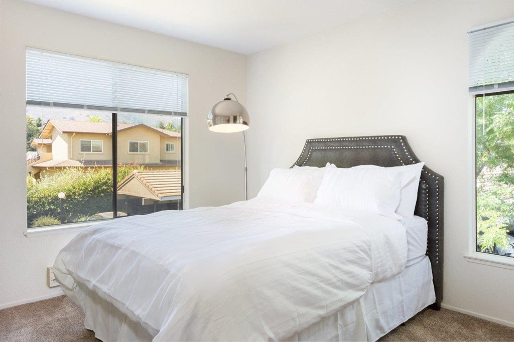 One Bedroom Apartments in Morgan Hill CA - Monte Vista - Furnished Bedroom with Carpeted Flooring and Large Windows