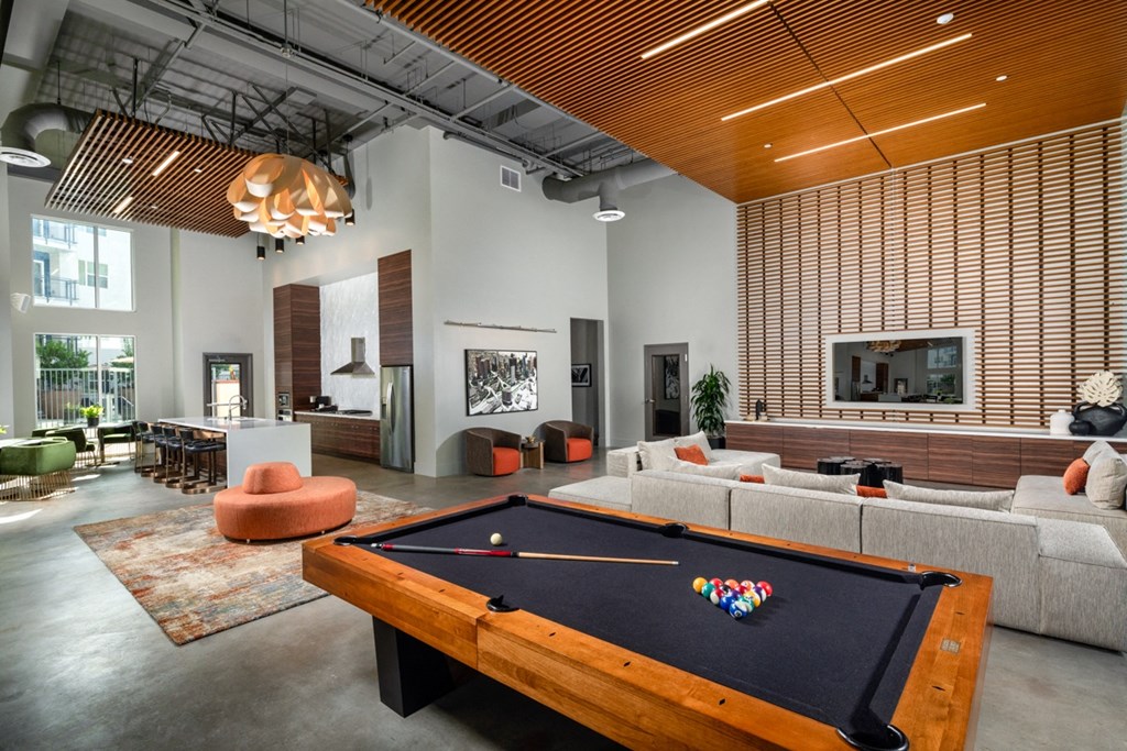 resident lounge of apartment complex with pool table at Aston at Gateway apartments in El Monte, California