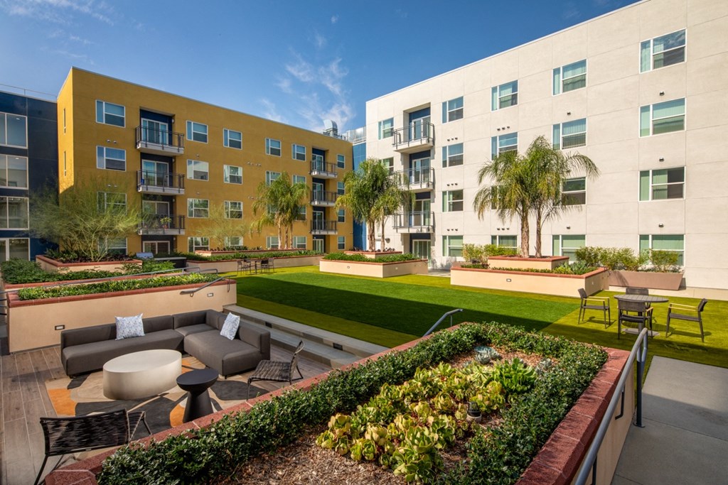 apartment with firepit and outdoor space at Aston at Gateway apartments in El Monte, California