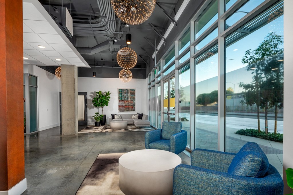elegant lobby with floor-to-ceiling windows at Aston at Gateway apartments in El Monte, California