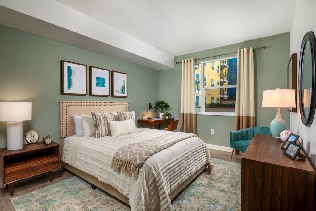 apartment bedroom with green accents at Aston at Gateway apartments in El Monte