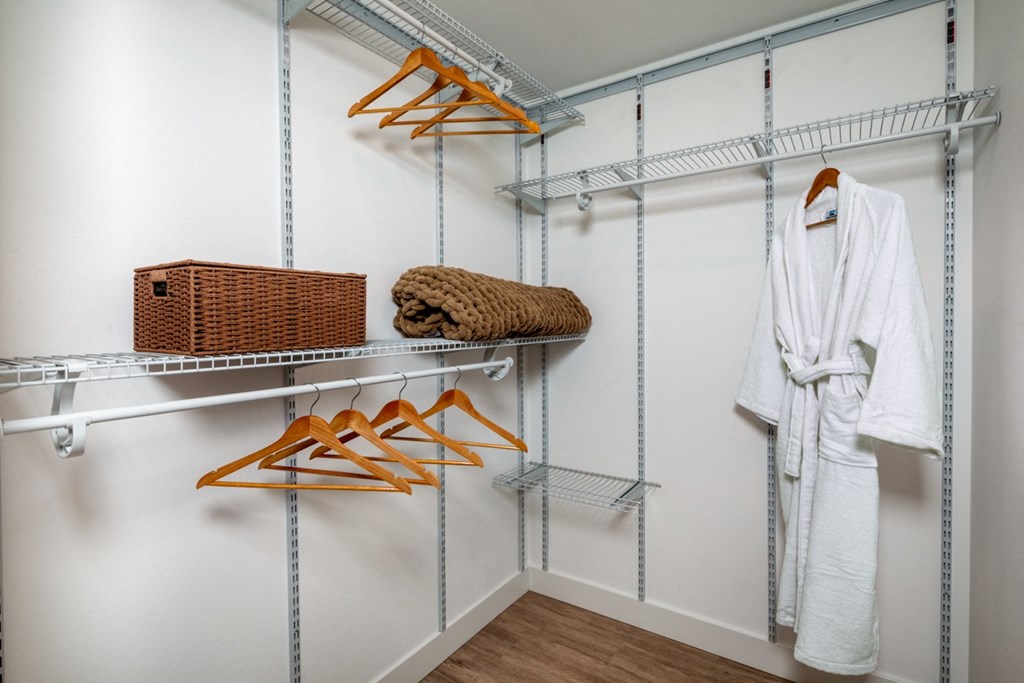 large closet room with multiple shelves at Aston at Gateway apartments in El Monte, California