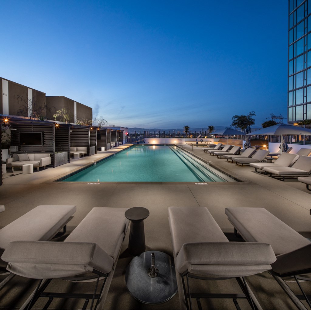 Pool with cabanas and lounge seating