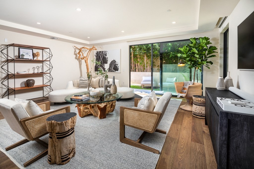 living area with coffee table chairs and large sliding door