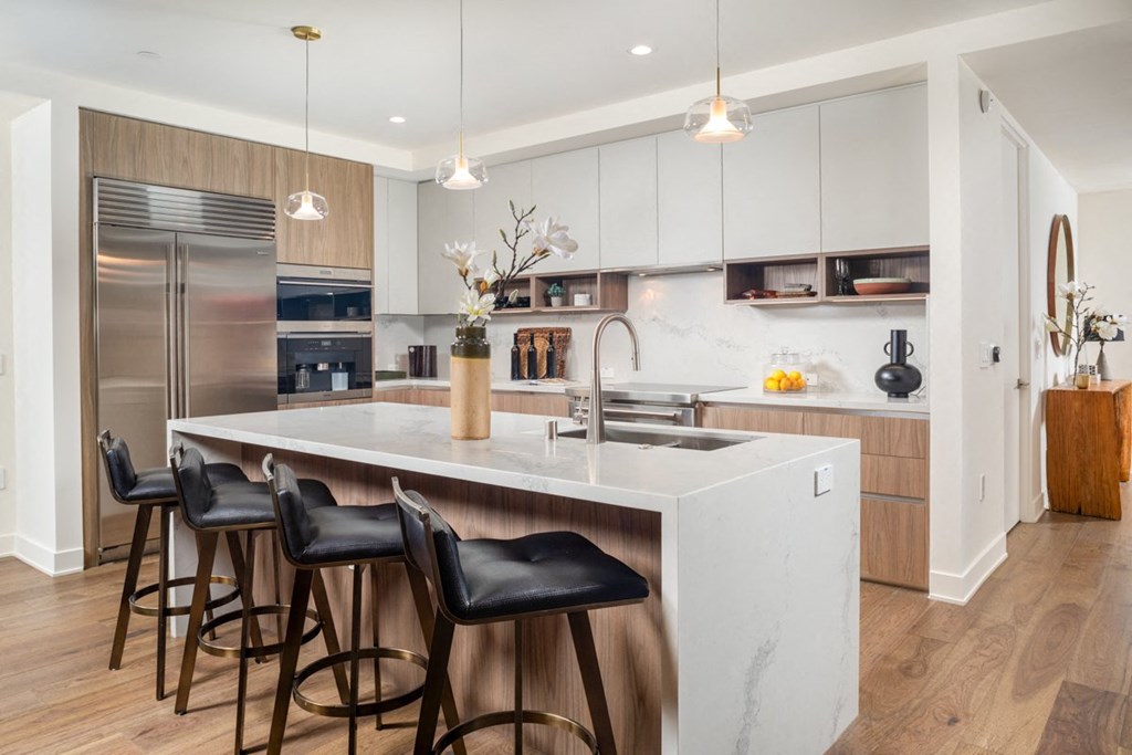 alfred kitchen with white counter and barstools