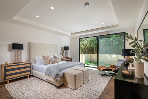 one bed primary bedroom with sliding door