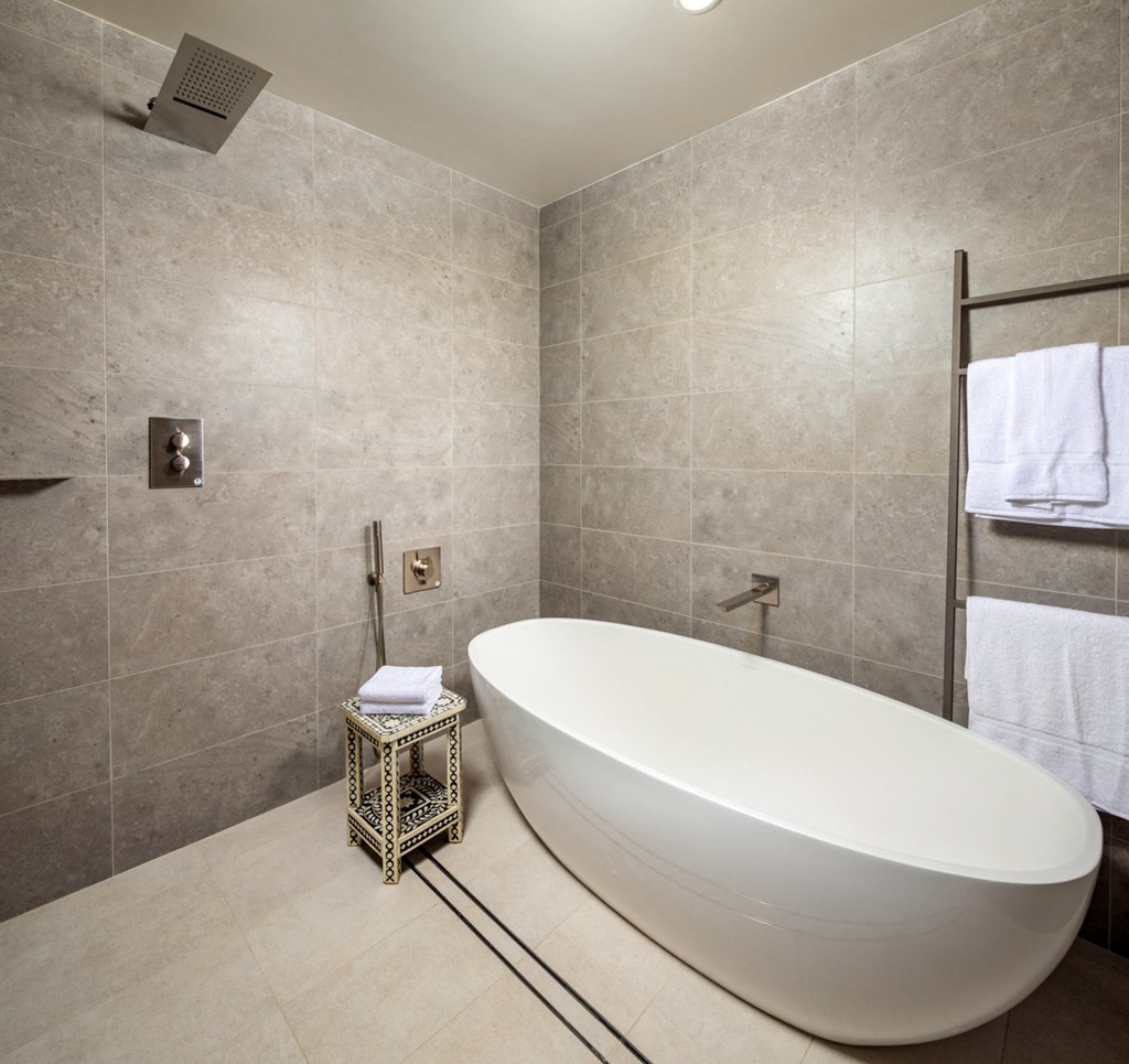 bathtub with rainfall shower head